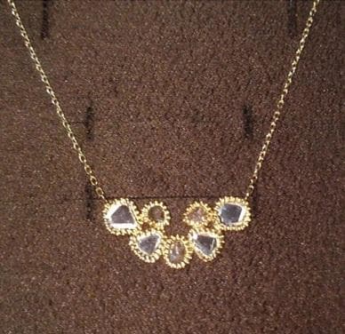 agete K14 gold necklace with a slice diamond pendant on a white background