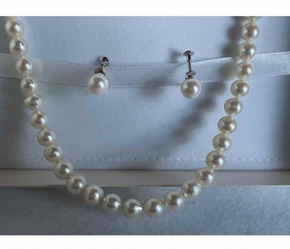 Genuine Akoya pearl necklace with 7.8mm semi-round pearls and matching 7mm pearl earrings in white color