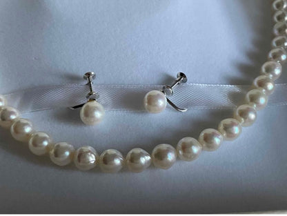 Genuine Akoya pearl necklace with 7.8mm semi-round pearls and matching 7mm pearl earrings in white color