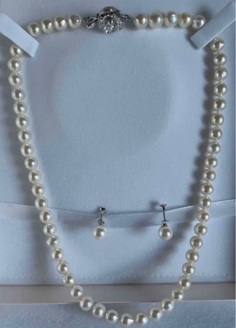 Genuine Akoya pearl necklace with 7.8mm semi-round pearls and matching 7mm pearl earrings in white color