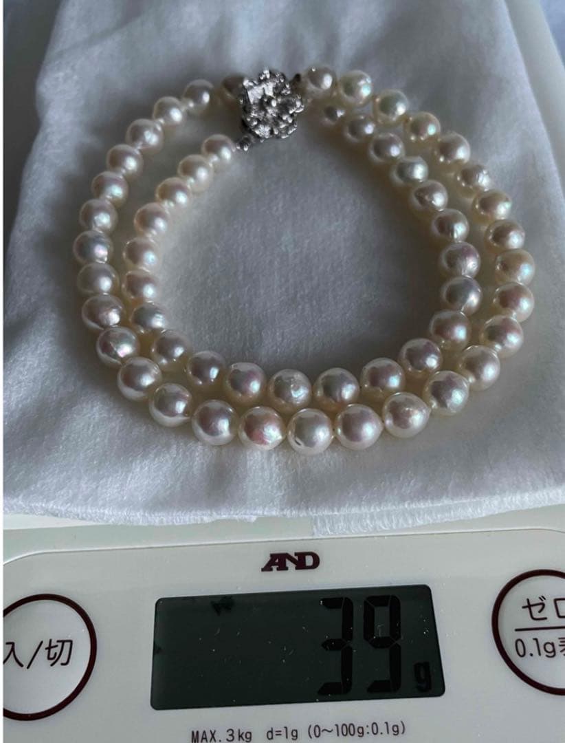 Genuine Akoya pearl necklace with 7.8mm semi-round pearls and matching 7mm pearl earrings in white color