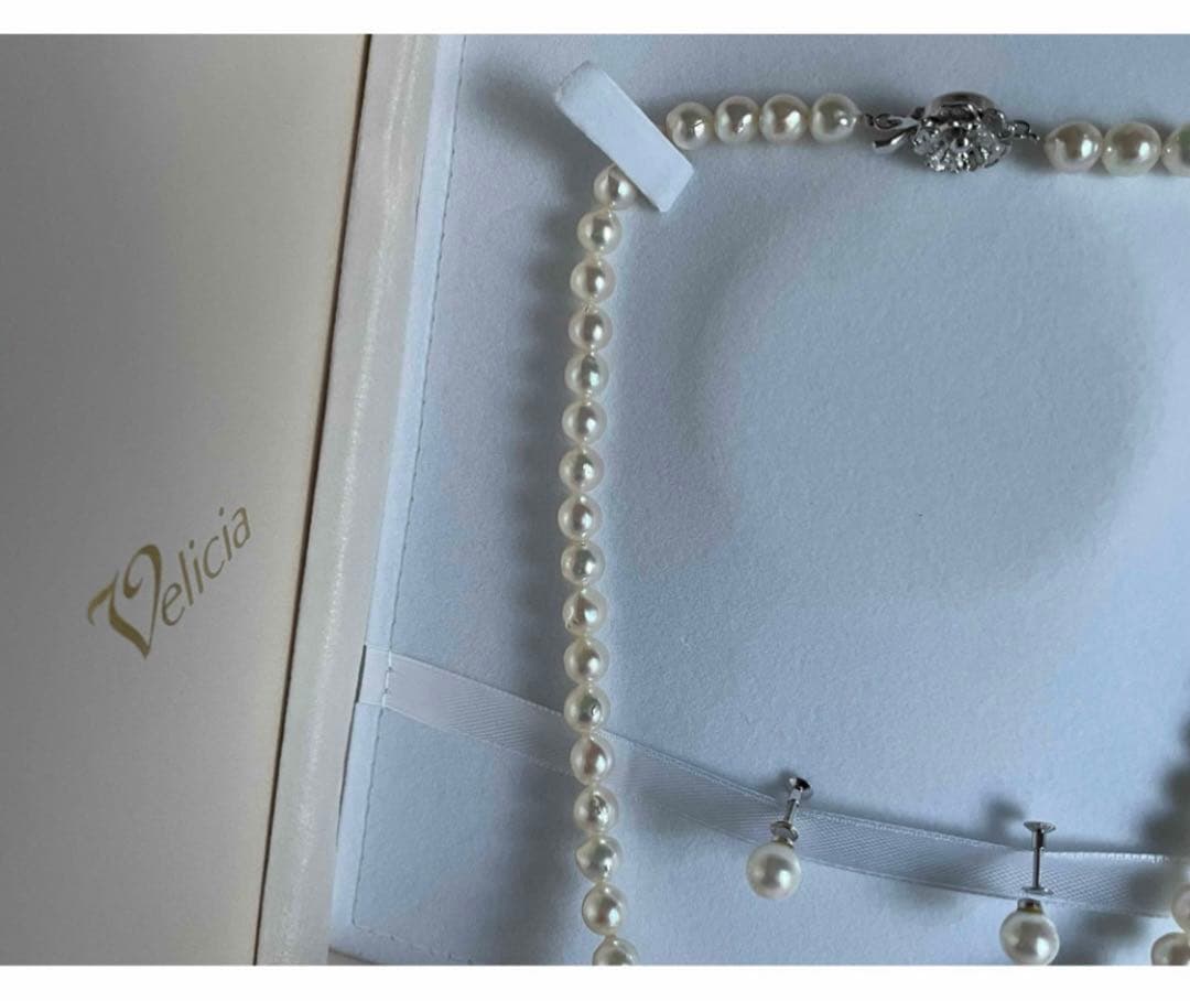 Genuine Akoya pearl necklace with 7.8mm semi-round pearls and matching 7mm pearl earrings in white color
