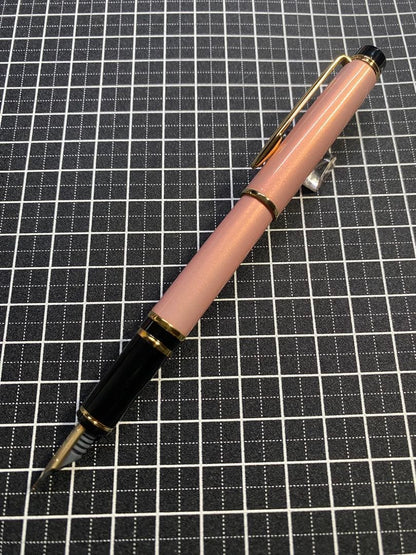 PILOT Grance fountain pen in pearl pink with fine 0.7mm 14K gold nib shown with cap off