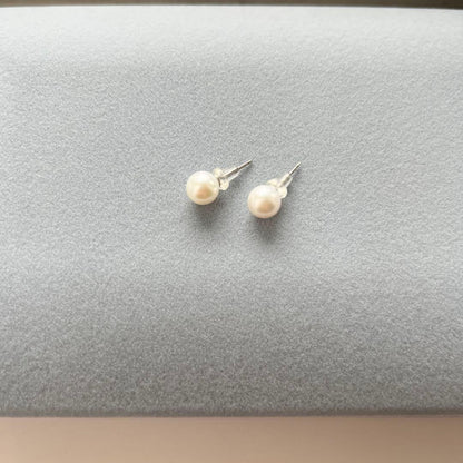 Akoya Pearl 3-piece set with necklace featuring single-pearl pendant and titanium earrings displayed in a gray case