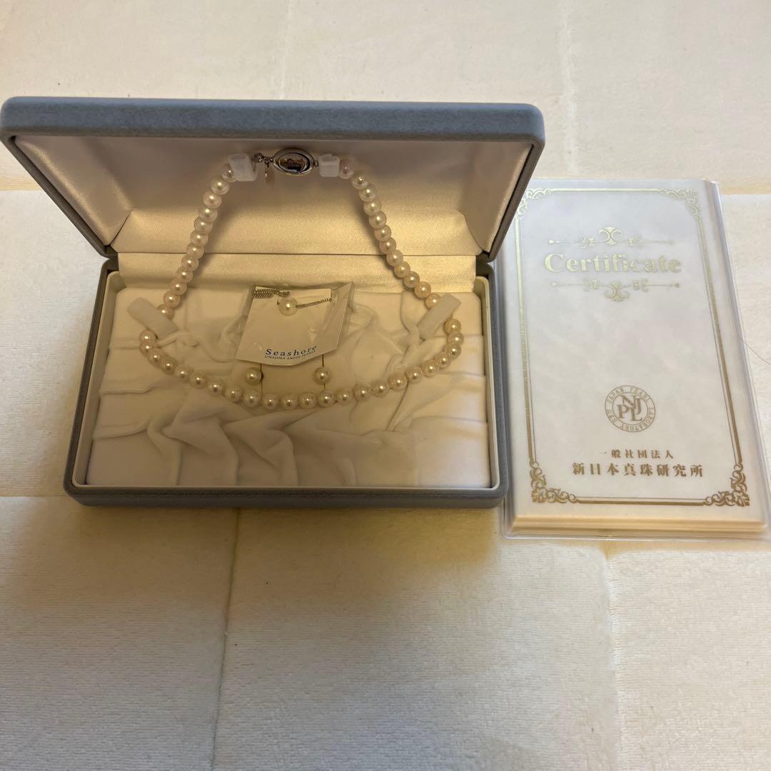 Akoya Pearl 3-piece set with necklace featuring single-pearl pendant and titanium earrings displayed in a gray case