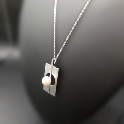 Mikimoto silver plate pearl ladies necklace with 6mm pearl and silver chain showing MS charm on pendant back