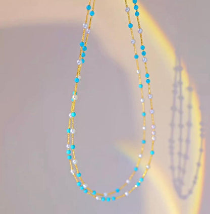 K18YG necklace featuring 3-4mm Akoya pearls and turquoise wire station on a 40cm chain