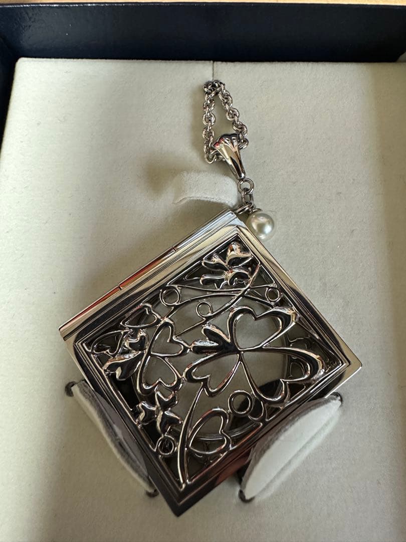 Mikimoto Loupe Pearl Chain Necklace with round pearls and fine chain alongside a small loupe accessory