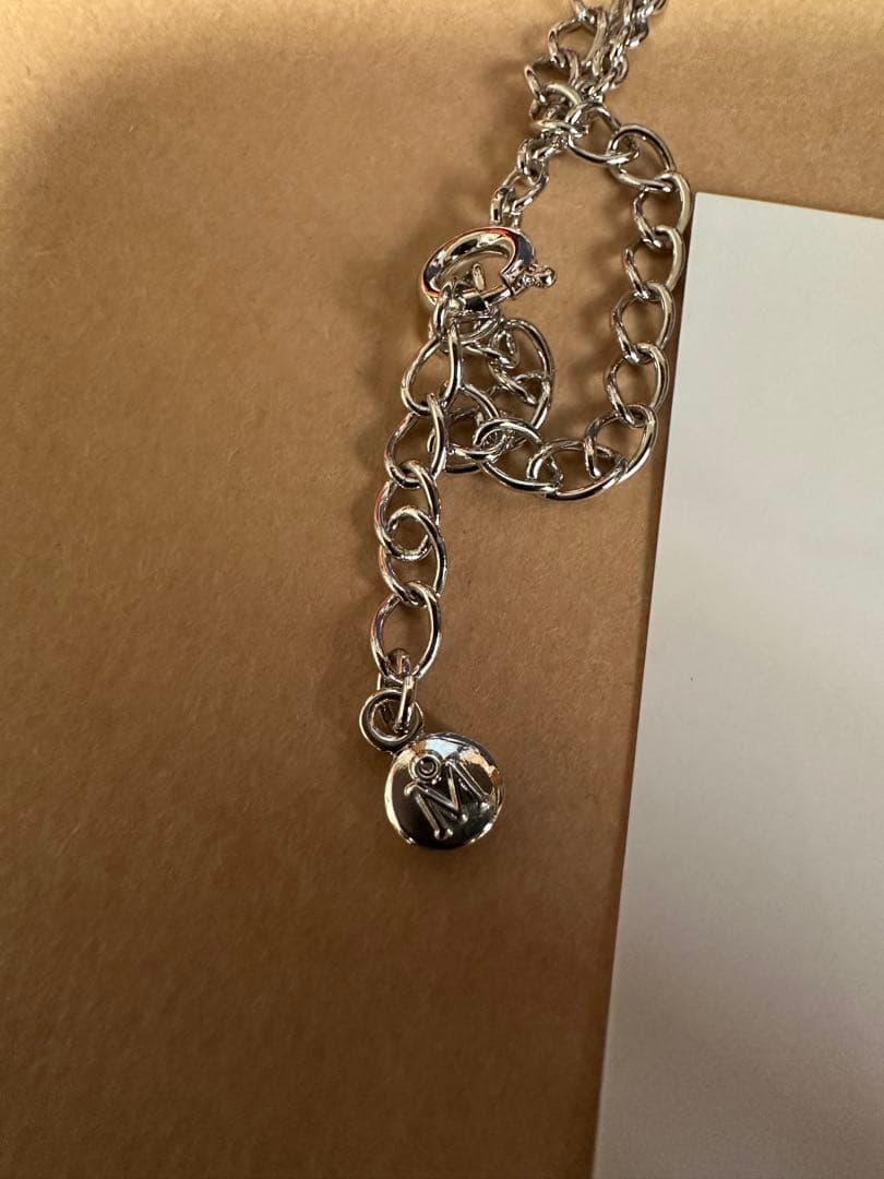 Mikimoto Loupe Pearl Chain Necklace with round pearls and fine chain alongside a small loupe accessory