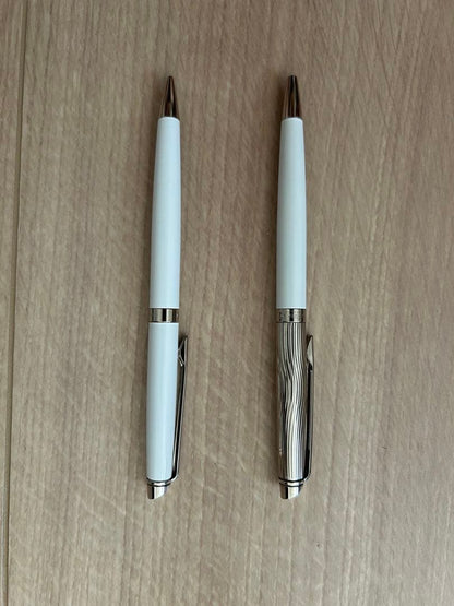 Waterman pen and mechanical pencil set with white bodies and wave-engraved cap