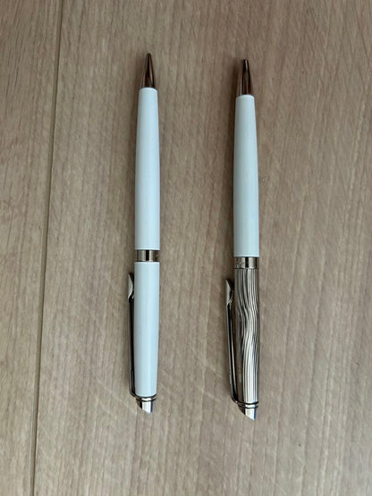 Waterman pen and mechanical pencil set with white bodies and wave-engraved cap