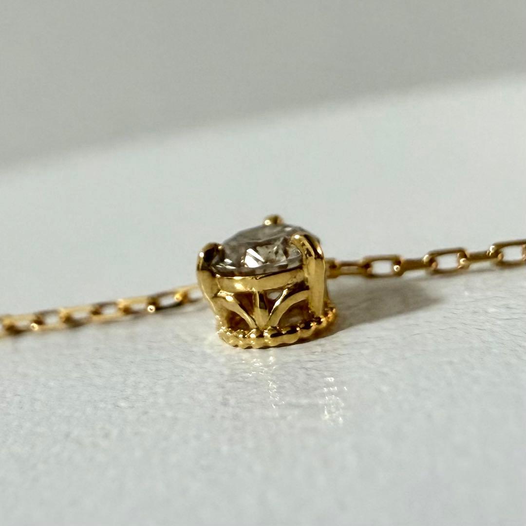 Agete Law K18 yellow gold necklace with 0.08 ct diamond and 40 cm chain displayed on white background