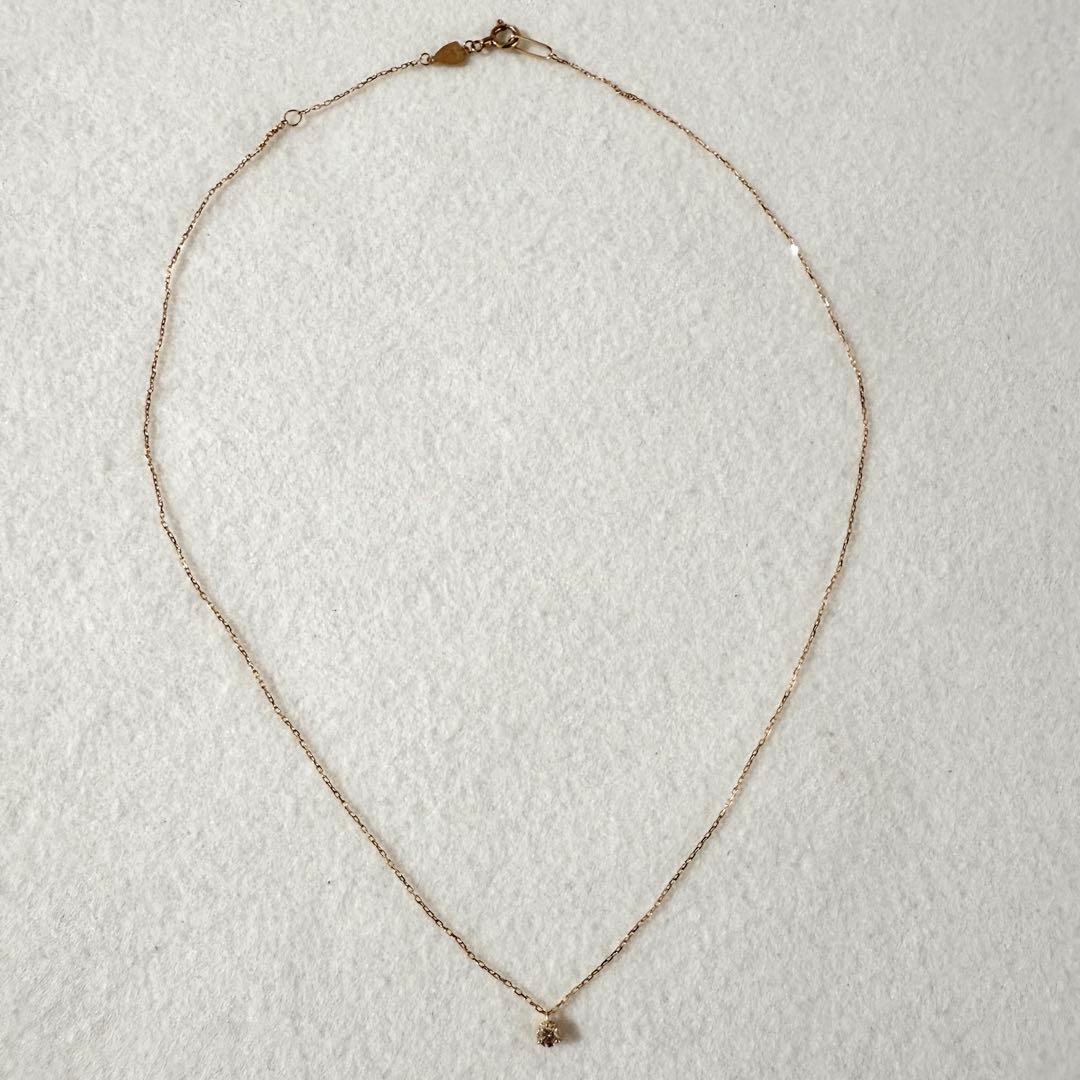 Agete Law K18 yellow gold necklace with 0.08 ct diamond and 40 cm chain displayed on white background