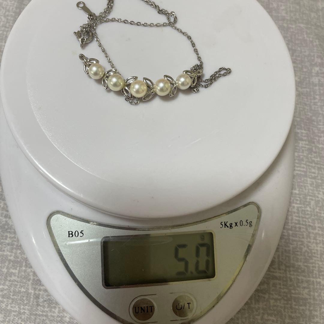 Mikimoto silver necklace with 5.7-6.0mm round pearls weighing 4.5 grams