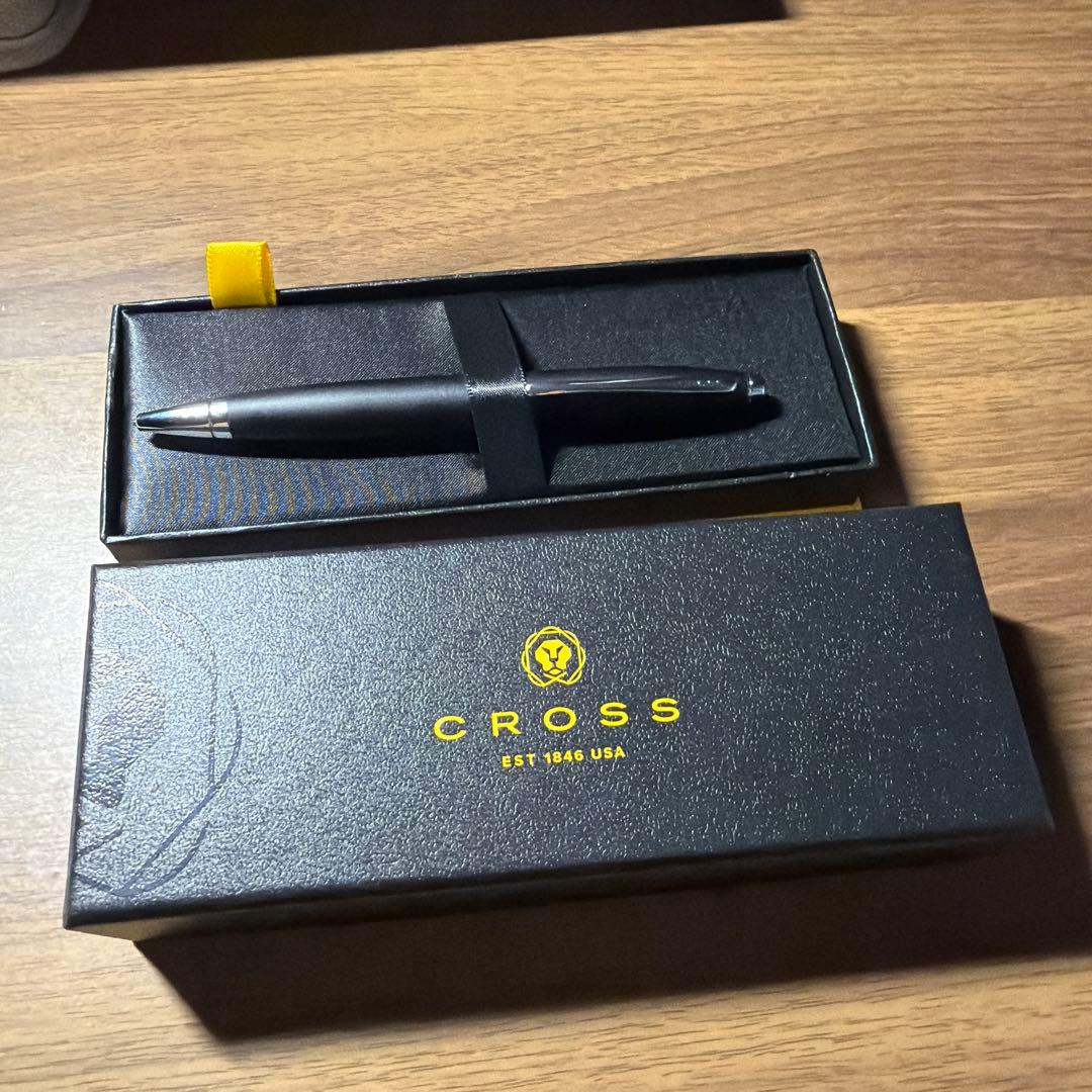 CROSS ballpoint pen in matte black finish with its dedicated protective case opened beside it