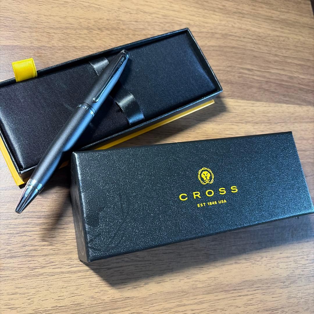 CROSS ballpoint pen in matte black finish with its dedicated protective case opened beside it