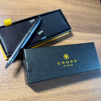 CROSS ballpoint pen in matte black finish with its dedicated protective case opened beside it