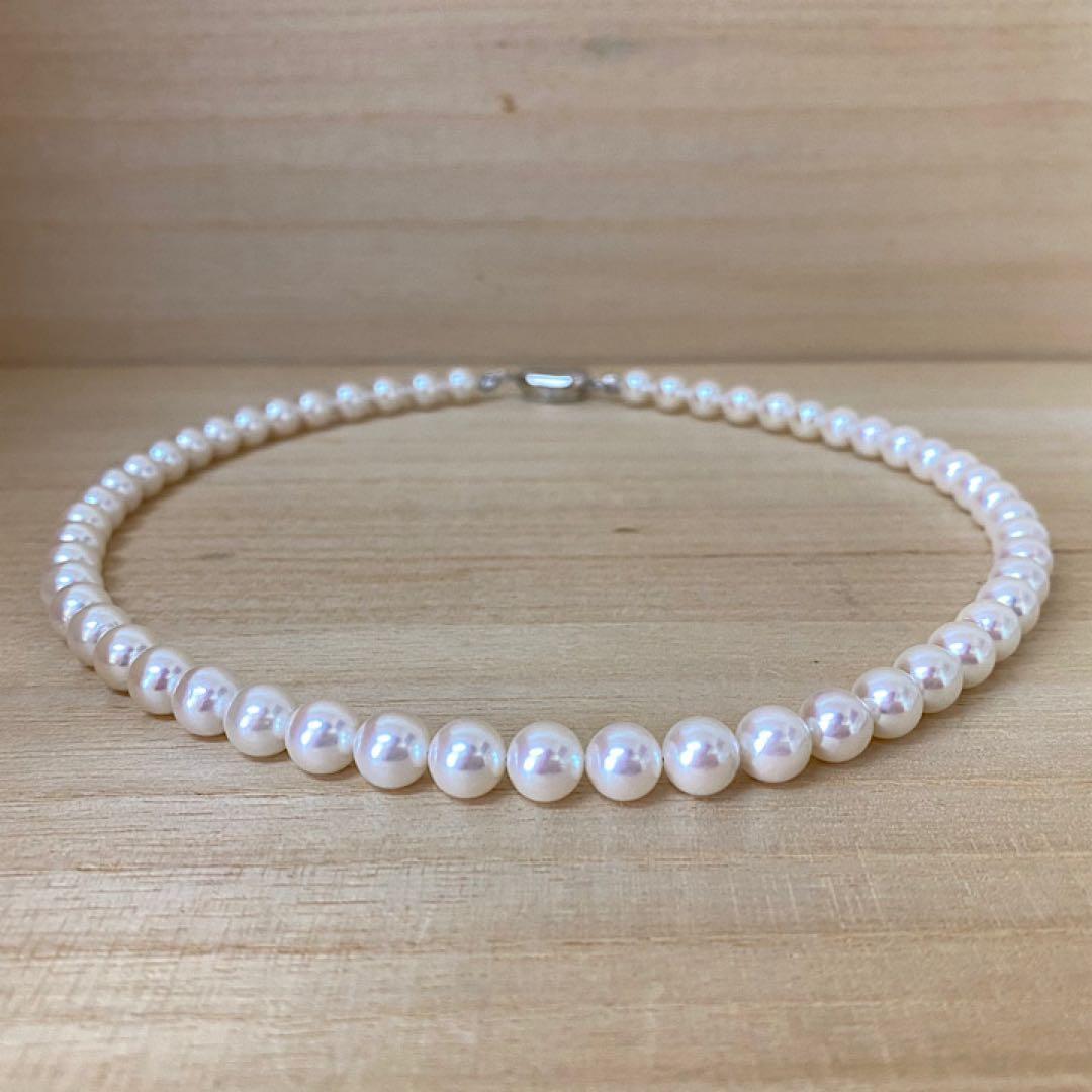 Akoya pearl necklace with 53 white uncolored pearls sized 7.5-8.0mm and silver one-touch clasp