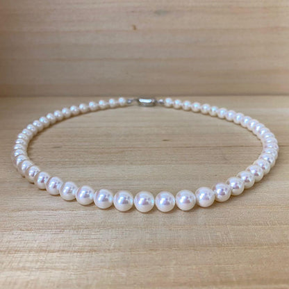 Akoya pearl necklace with 53 white uncolored pearls sized 7.5-8.0mm and silver one-touch clasp