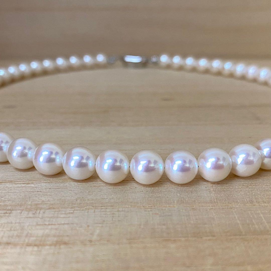 Akoya pearl necklace with 53 white uncolored pearls sized 7.5-8.0mm and silver one-touch clasp