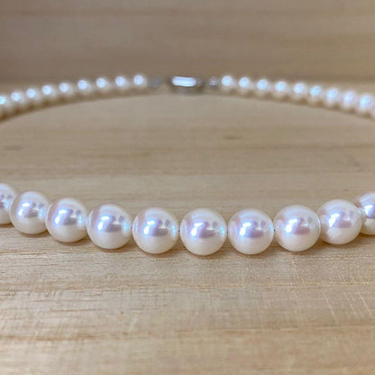 Akoya pearl necklace with 53 white uncolored pearls sized 7.5-8.0mm and silver one-touch clasp