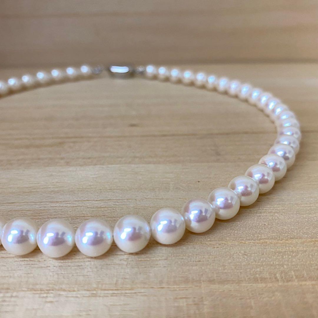 Akoya pearl necklace with 53 white uncolored pearls sized 7.5-8.0mm and silver one-touch clasp