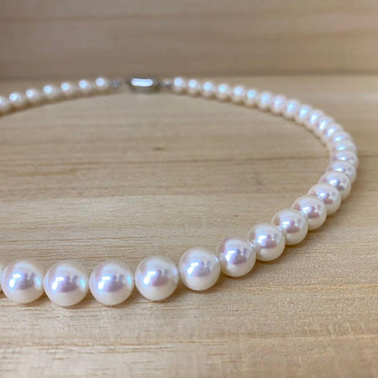 Akoya pearl necklace with 53 white uncolored pearls sized 7.5-8.0mm and silver one-touch clasp