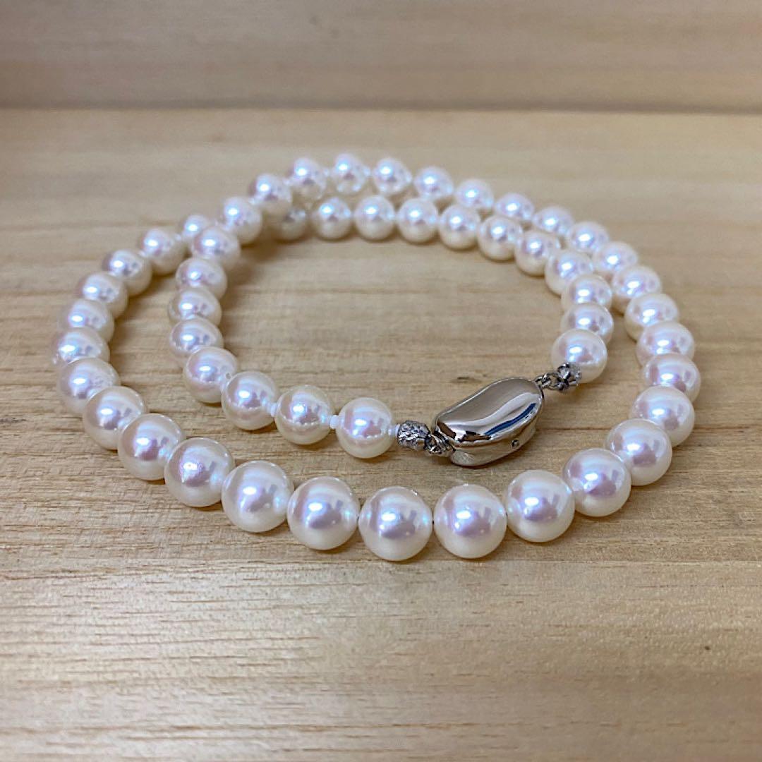 Akoya pearl necklace with 53 white uncolored pearls sized 7.5-8.0mm and silver one-touch clasp