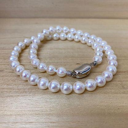 Akoya pearl necklace with 53 white uncolored pearls sized 7.5-8.0mm and silver one-touch clasp