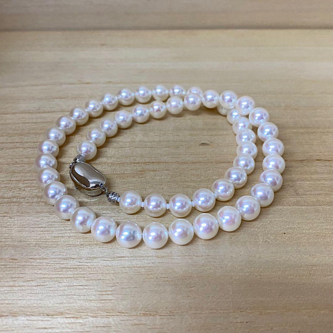 Akoya pearl necklace with 53 white uncolored pearls sized 7.5-8.0mm and silver one-touch clasp
