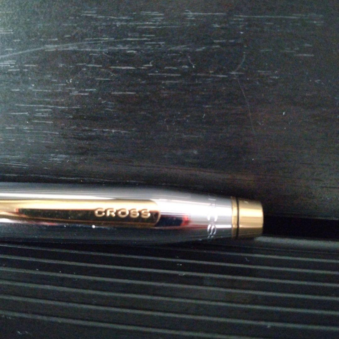 Cross Century II oil-based ballpoint pen with silver and gold brass body and medium black ink