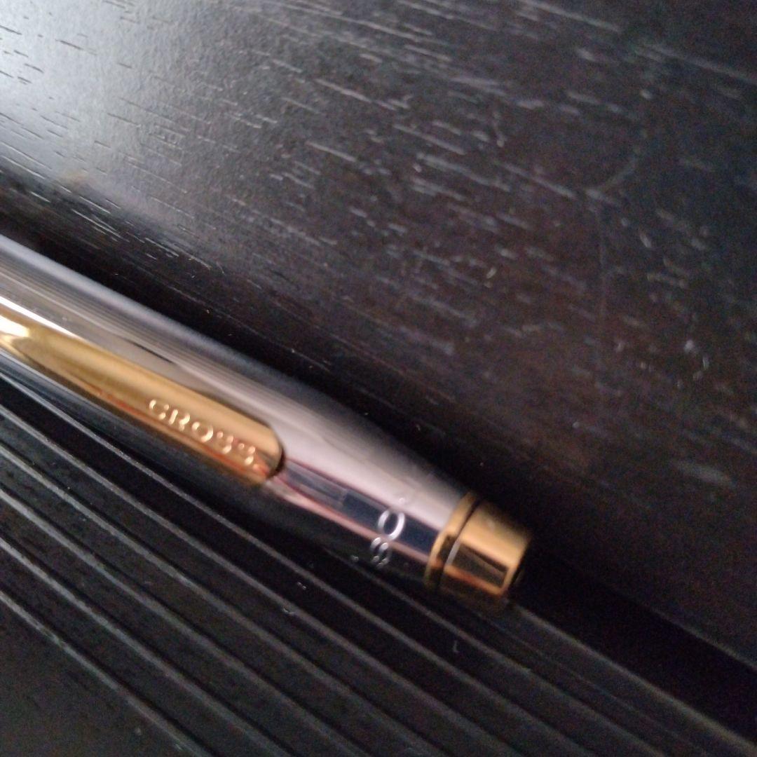 Cross Century II oil-based ballpoint pen with silver and gold brass body and medium black ink