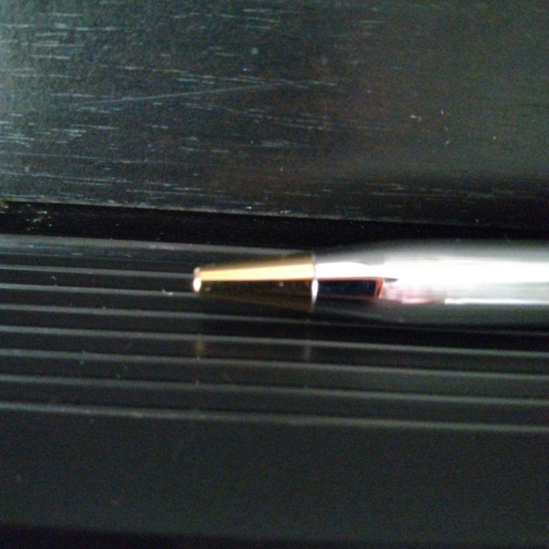 Cross Century II oil-based ballpoint pen with silver and gold brass body and medium black ink