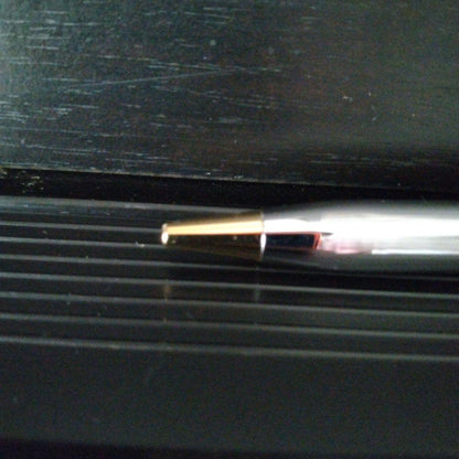 Cross Century II oil-based ballpoint pen with silver and gold brass body and medium black ink