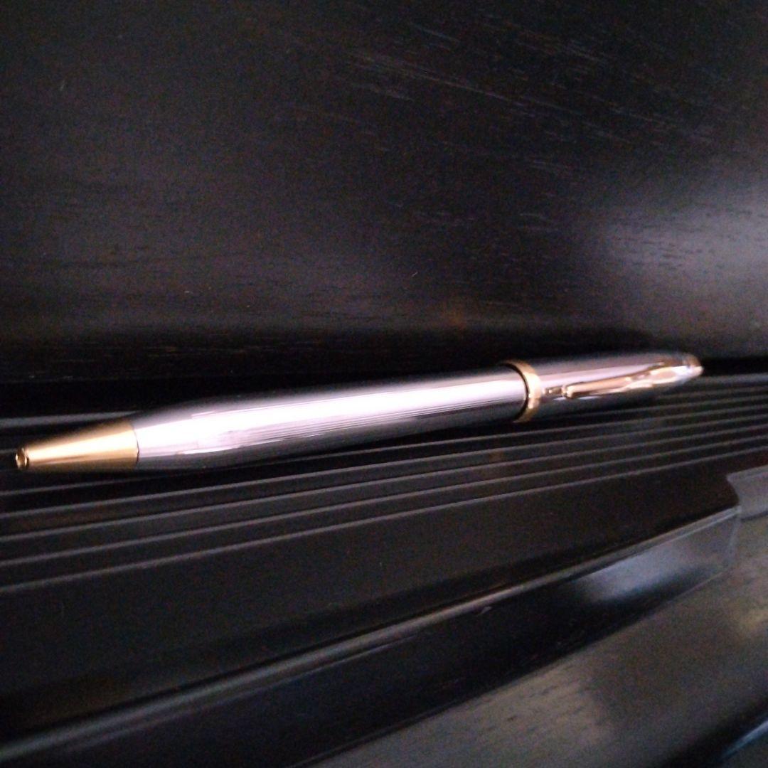 Cross Century II oil-based ballpoint pen with silver and gold brass body and medium black ink