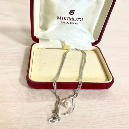 Mikimoto Akoya Pearl Pendant Necklace with silver chain and single 7mm pearl on white background