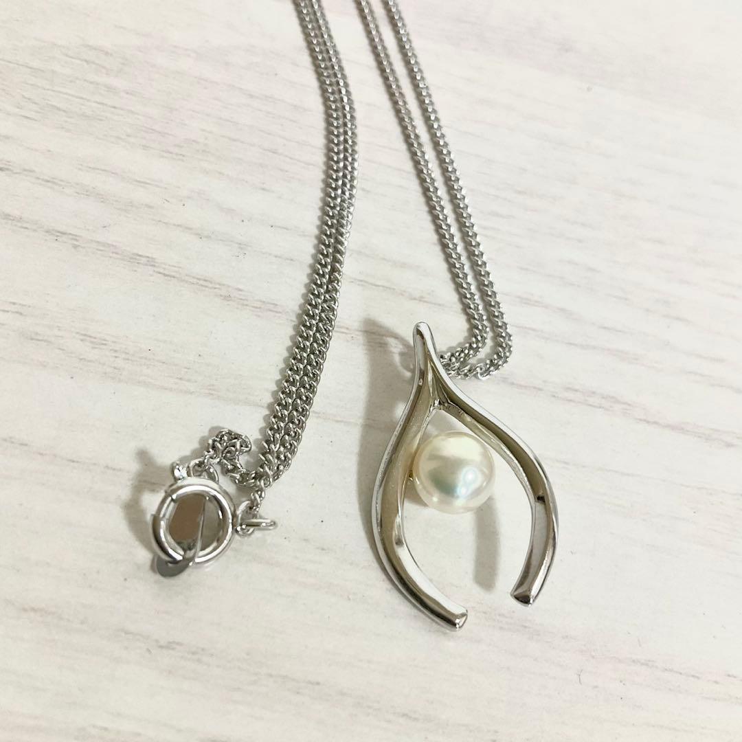 Mikimoto Akoya Pearl Pendant Necklace with silver chain and single 7mm pearl on white background