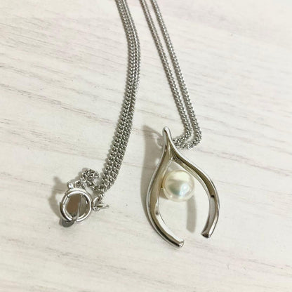 Mikimoto Akoya Pearl Pendant Necklace with silver chain and single 7mm pearl on white background