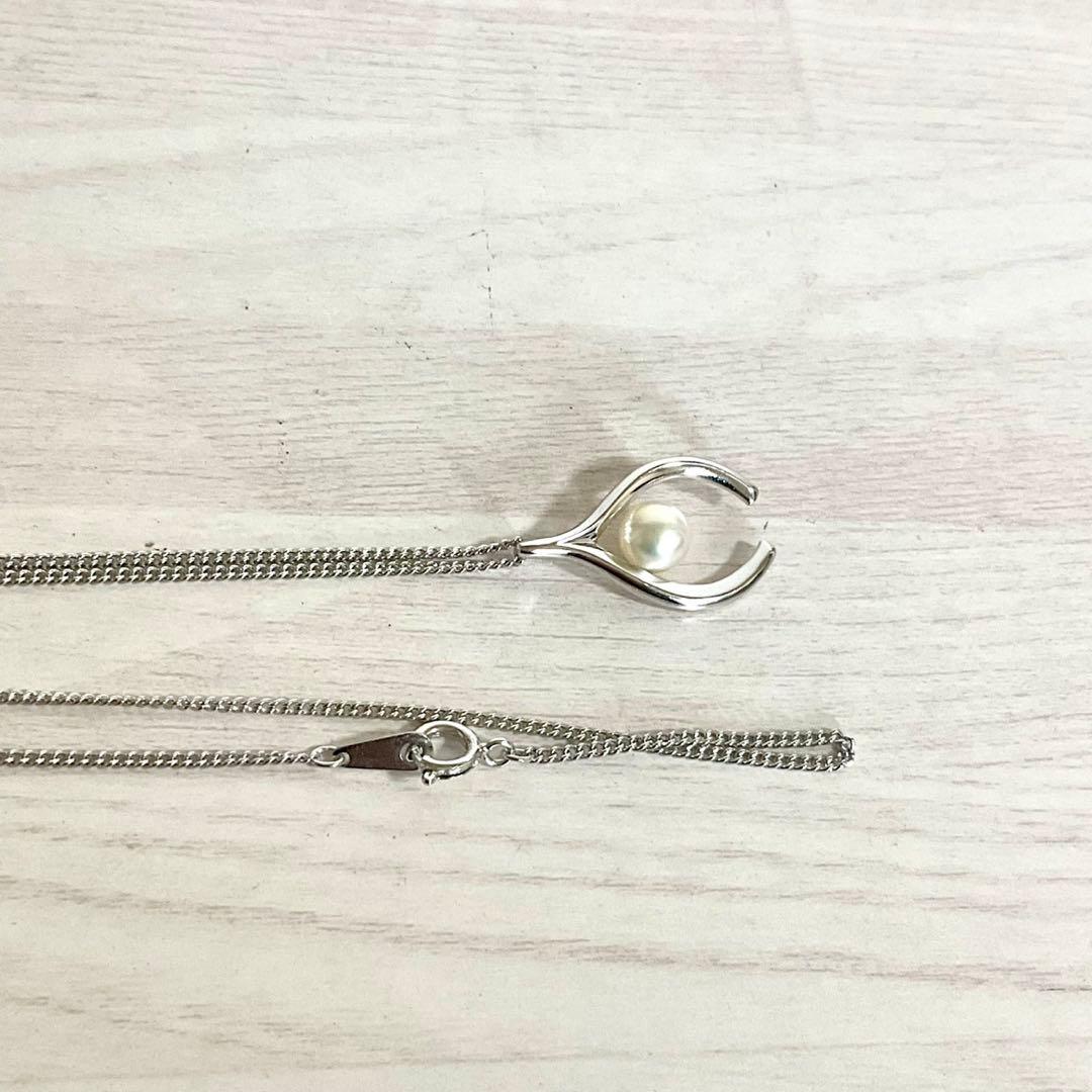 Mikimoto Akoya Pearl Pendant Necklace with silver chain and single 7mm pearl on white background