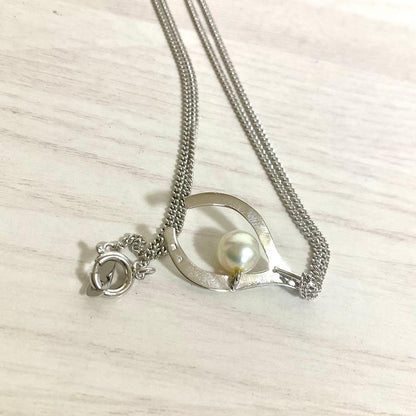 Mikimoto Akoya Pearl Pendant Necklace with silver chain and single 7mm pearl on white background