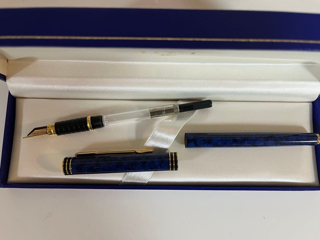 Waterman fountain pen with sleek design, uncapped showing nib, black body