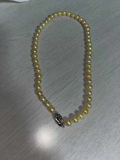 Akoya pearl necklace featuring 7mm pearls with a total length of 43cm displayed on a white background