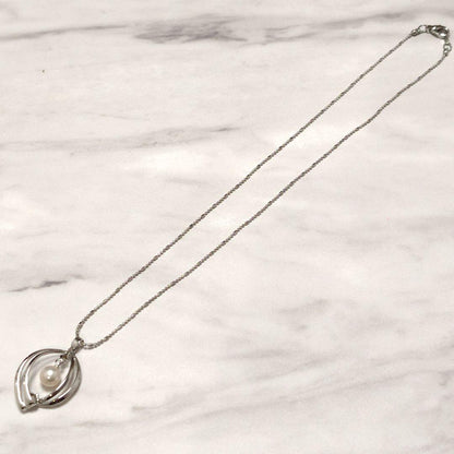 Mikimoto genuine pearl pendant necklace with a 0.6 cm pearl on a 40 cm chain and bonus metal necklace