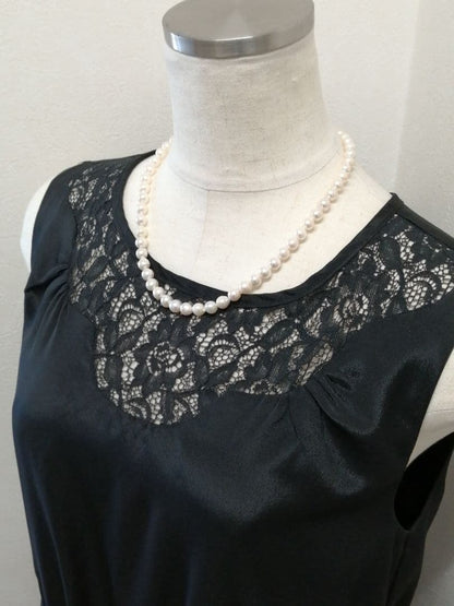 Akoya pearl necklace with white and cream semi-round to baroque pearls and silver hook clasp