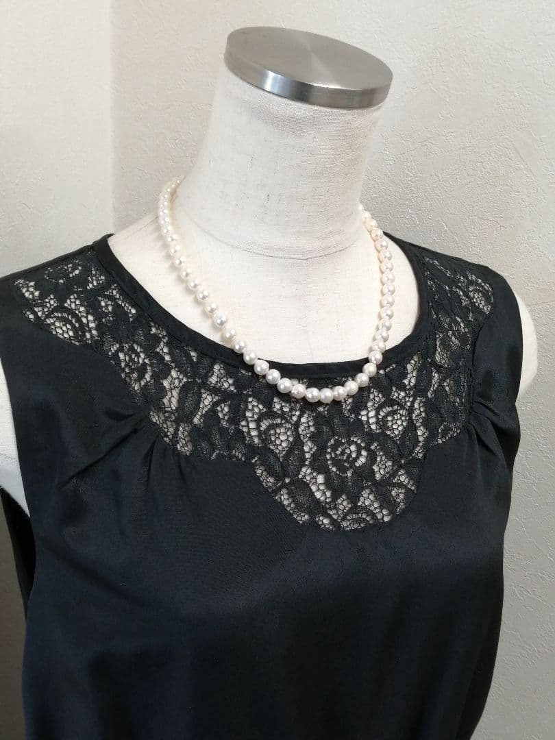 Akoya pearl necklace with white and cream semi-round to baroque pearls and silver hook clasp