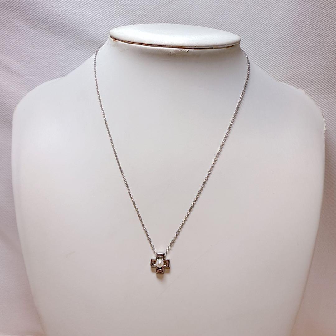 Tasaki silver cross necklace featuring a single pearl pendant on an adjustable metal chain length 39 to 42.5 cm