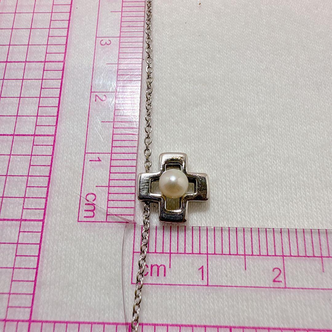 Tasaki silver cross necklace featuring a single pearl pendant on an adjustable metal chain length 39 to 42.5 cm