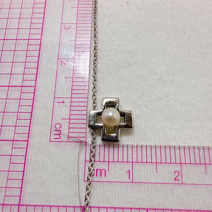 Tasaki silver cross necklace featuring a single pearl pendant on an adjustable metal chain length 39 to 42.5 cm