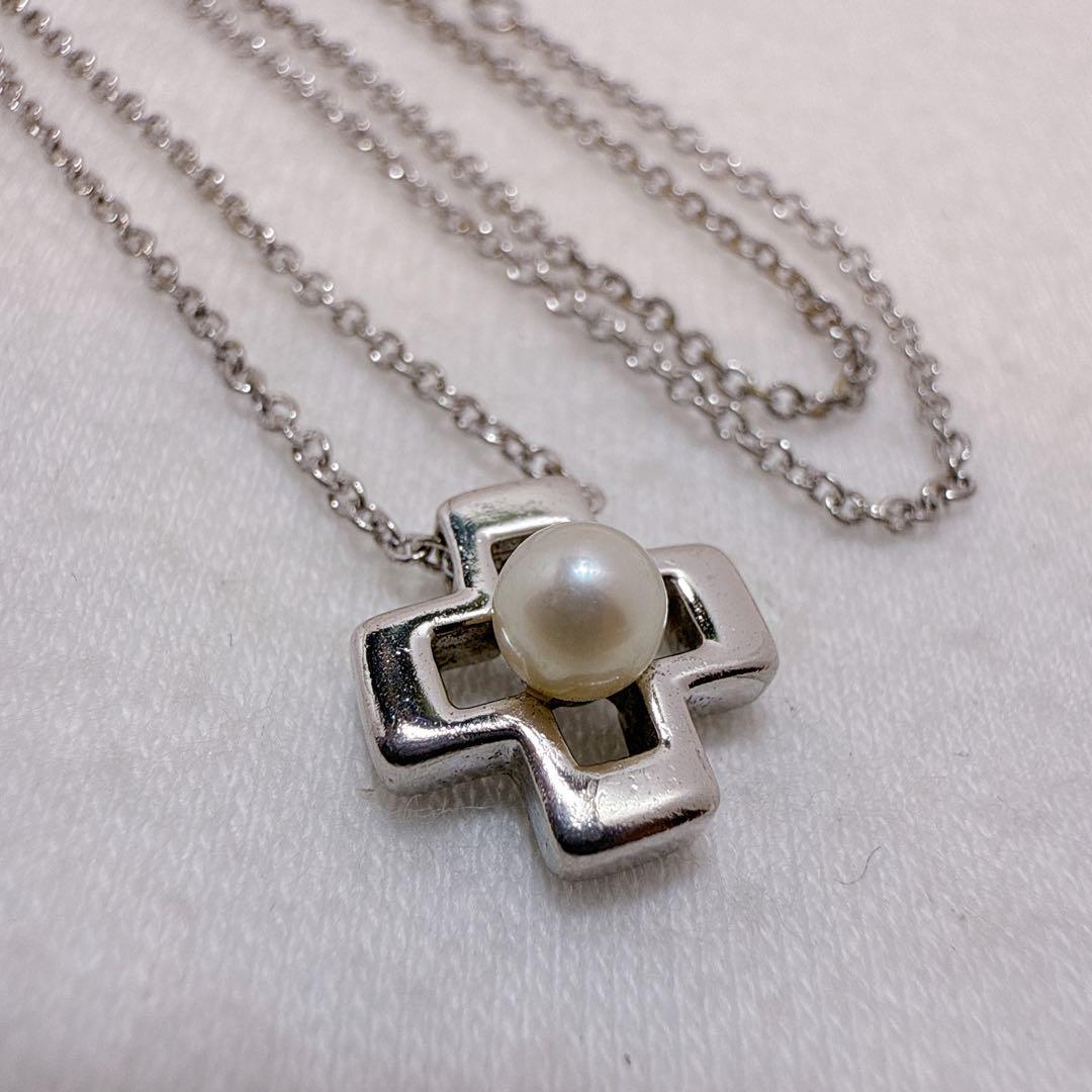 Tasaki silver cross necklace featuring a single pearl pendant on an adjustable metal chain length 39 to 42.5 cm
