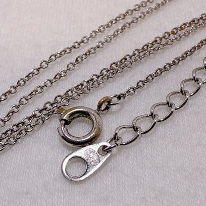 Tasaki silver cross necklace featuring a single pearl pendant on an adjustable metal chain length 39 to 42.5 cm